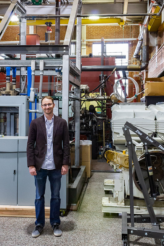 Mechanical engineering assistant professor Bret Windom stands in the engines lab at the CSU Powerhouse Campus, September 27, 2019.