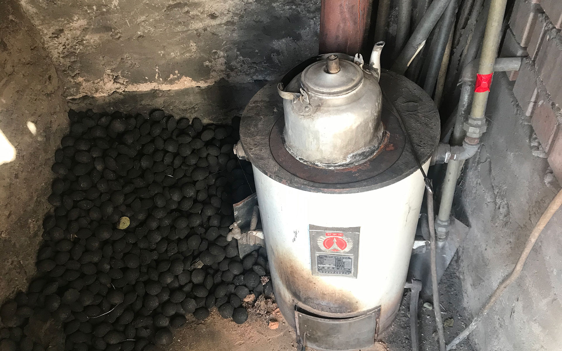 Coal stove and pile of coal