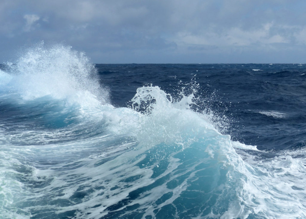 A wave breaks off the side of the Australian Marine National Facility research vessel, the R/V Investigator, during the SOCRATES field campaign. CSU researchers found sea spray emissions dominate cloud-forming material over the Southern Ocean. Photo by Peter Shanks (CSIRO, AU).