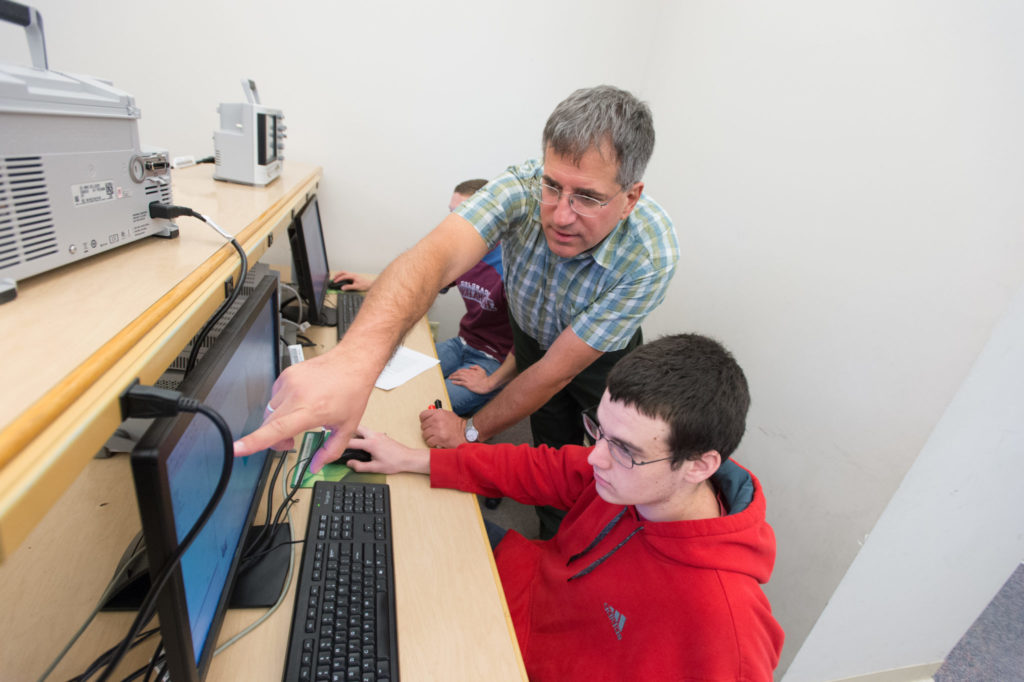 University Distinguished Teaching Scholar Branislav Notaros working with a student on electromagnetic simulations.