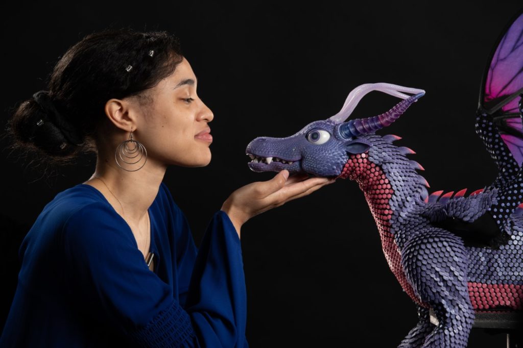 Electrical Engineering alumnae Victoria Bohannon-Pea with the animatronic dragon she developed.