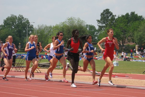 A picture of women running in a track and field event.