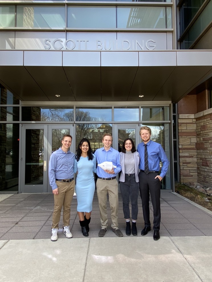 A picture of five students standing in front of the Scott Bioengineering Building.