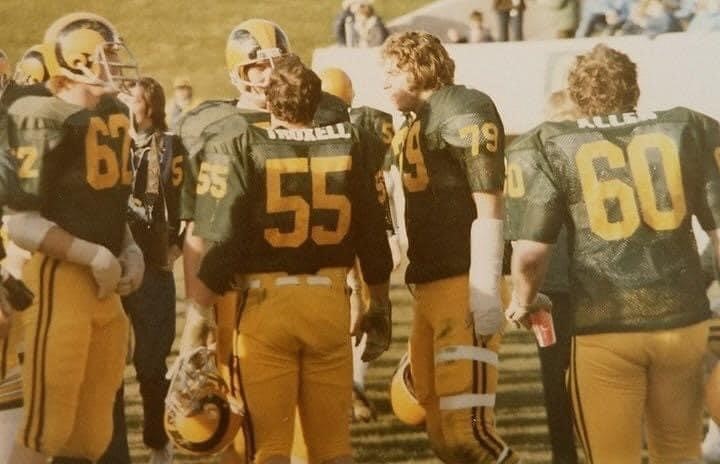 A picture of CSU football players huddling in the 1970s.