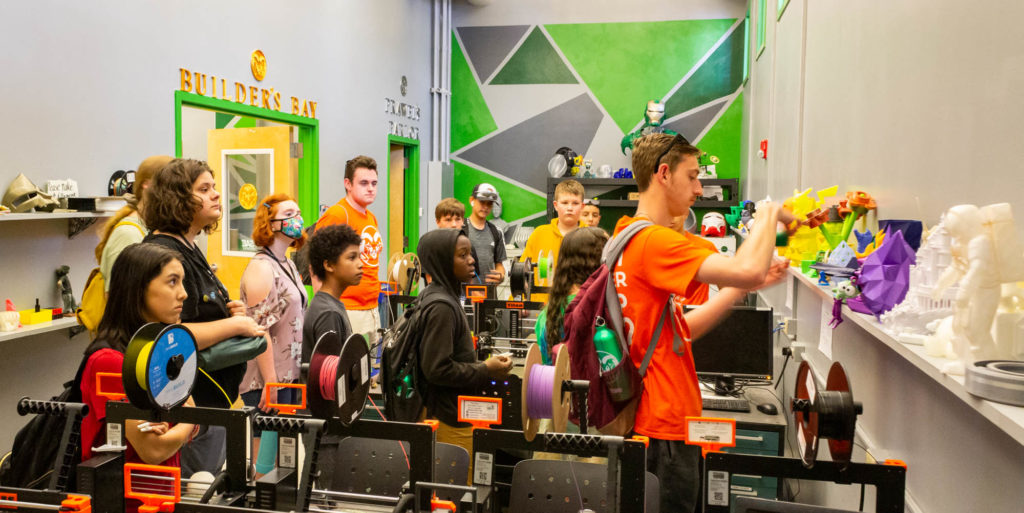 Photo showing middle school students in a 3D printing lab
