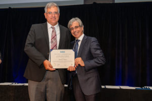 Branislav Notaros (left) receives the best paper award at the IEEE APS annual conference.