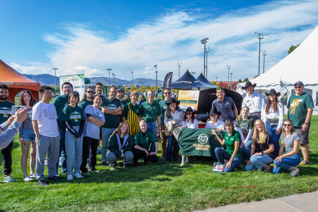 Faculty, staff, and students of the Walter Scott, Jr. College of Engineering pose with Cam the Ram and team at the Engineering Ram Town tent during Colorado State University's Homecoming, October 15, 2022. Photo credit: Walter Scott, Jr. College of Engineering.