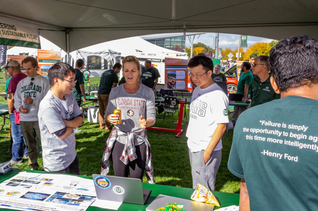Faculty, staff, and students of the Walter Scott, Jr. College of Engineering explain research projects and greet the crowd at the Engineering Ram Town tent during Colorado State University's Homecoming, October 15, 2022. Photo credit: Walter Scott, Jr. College of Engineering.