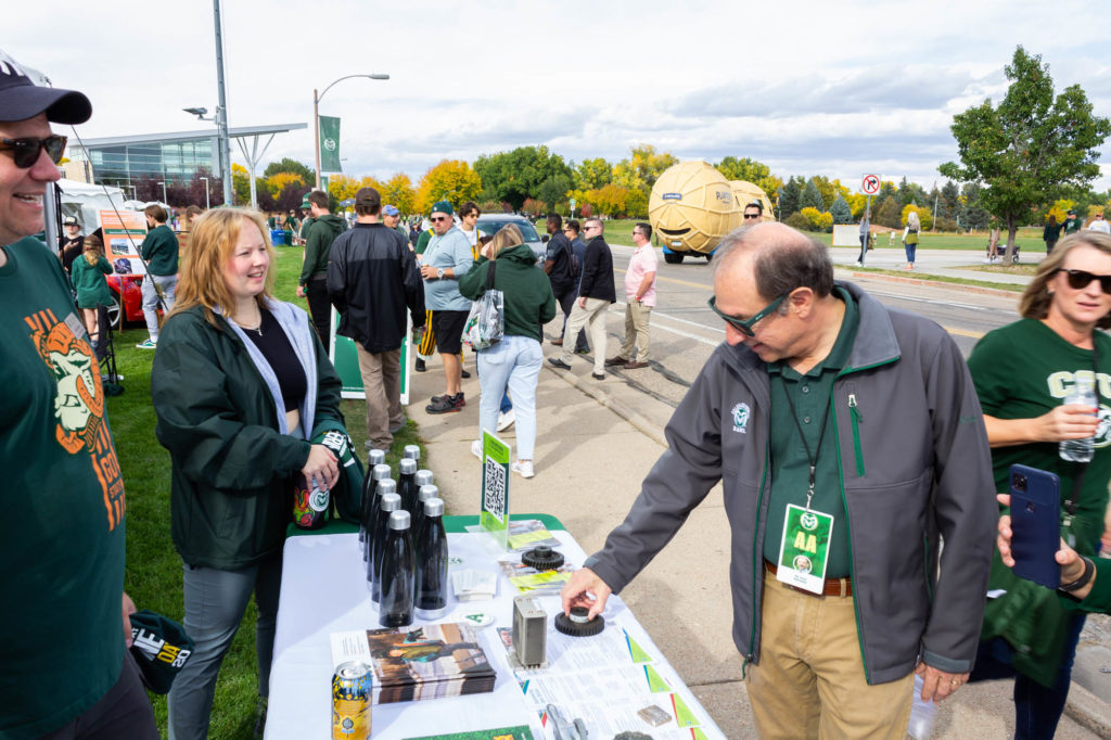 Faculty, staff, and students of the Walter Scott, Jr. College of Engineering explain research projects and greet the crowd at the Engineering Ram Town tent during Colorado State University's Homecoming, October 15, 2022. Photo credit: Walter Scott, Jr. College of Engineering.