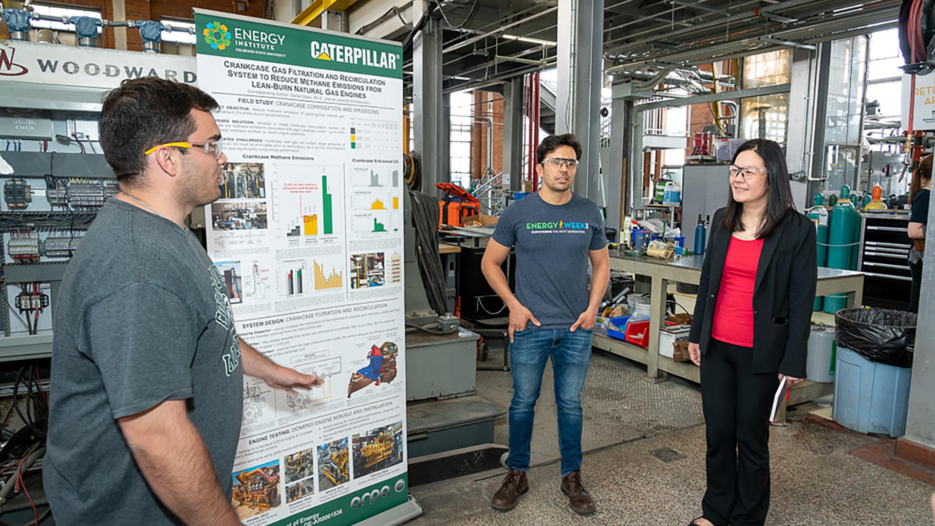 Evelyn Wang meets with researchers at powerhouse energy campus