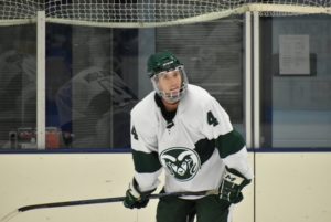 Wilson on the ice for CSU hockey in his #4 jersey and helmet with clear face guard