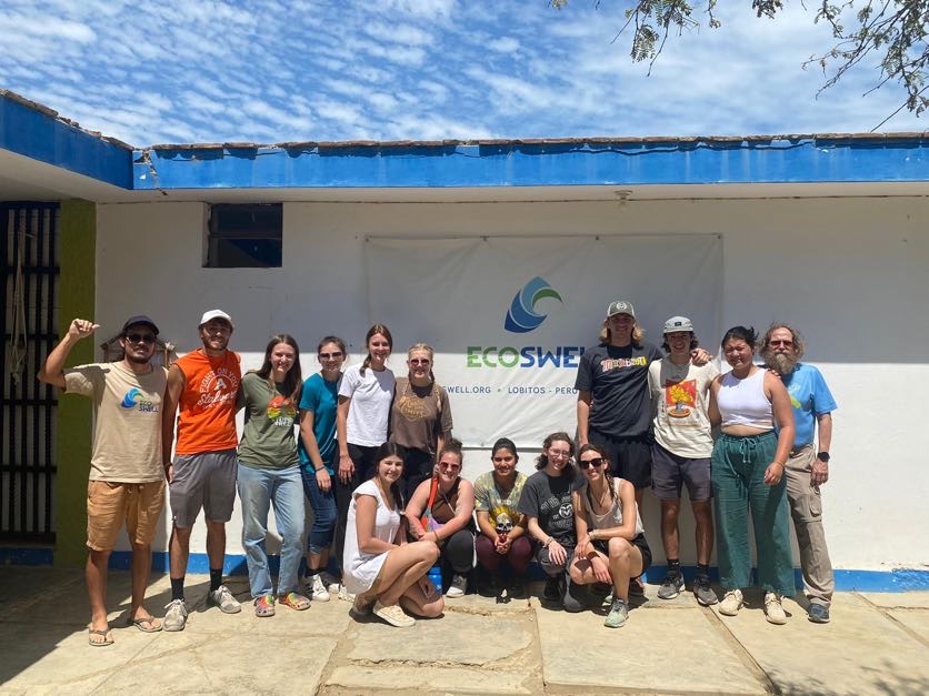 Siller and the students pose for a group portrait in front of the EcoSwell offices in Peru