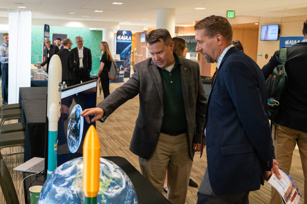Matt Rogers, assistant director of outreach and communications for the Cooperative Institute for Research in the Atmosphere, shows Mechanical Engineering Department Head Christian Puttlitz CIRA’s live satellite feed.