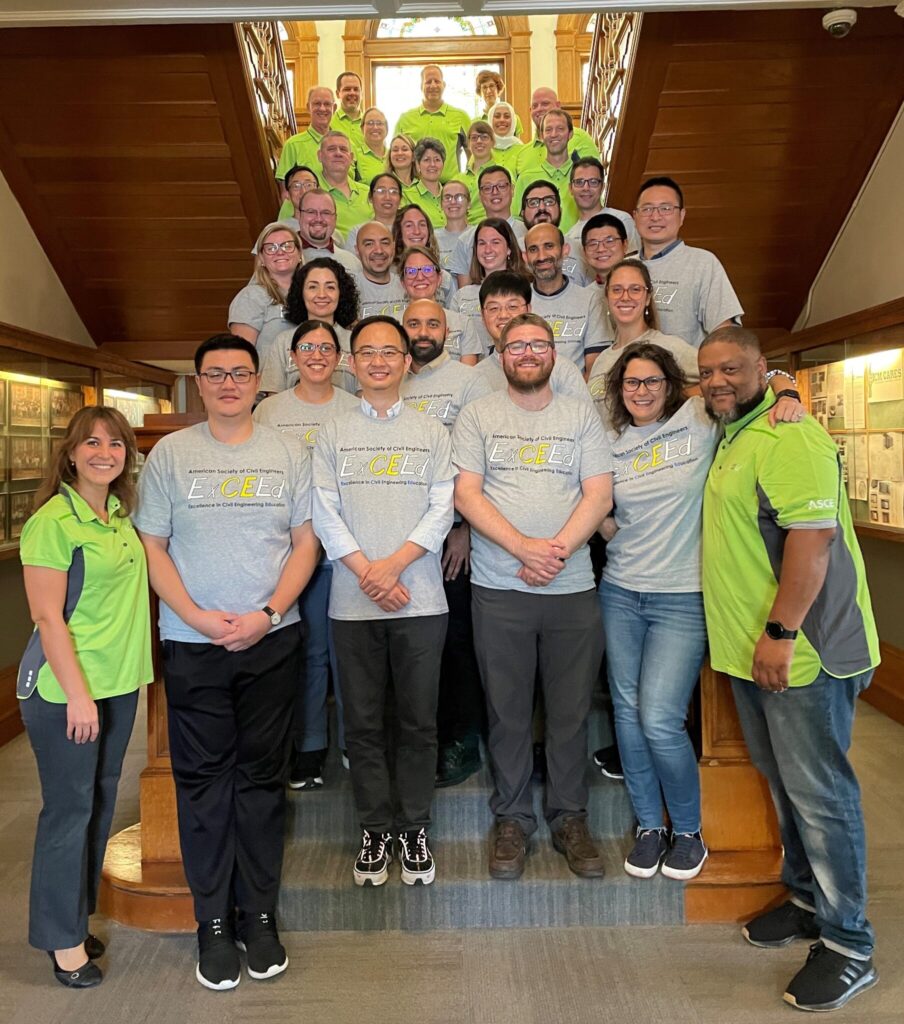 An informal group photo of ExCEEd participants and instructors, wearing the lime-green instructor shirts or grey T-shirts bearing the "ExCEEd" logo.