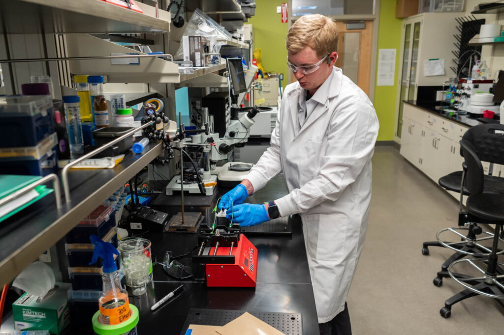 Environmental engineering student Robert Lamm working in the laboratory of Chemical and Biological Engineering Professor Chris Snow.