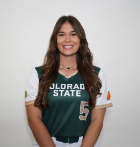 Studio portrait of Sydney Hornbuckle in her CSU Softball jersey. Her number 5 and part of the words "Colorado State" are visible.